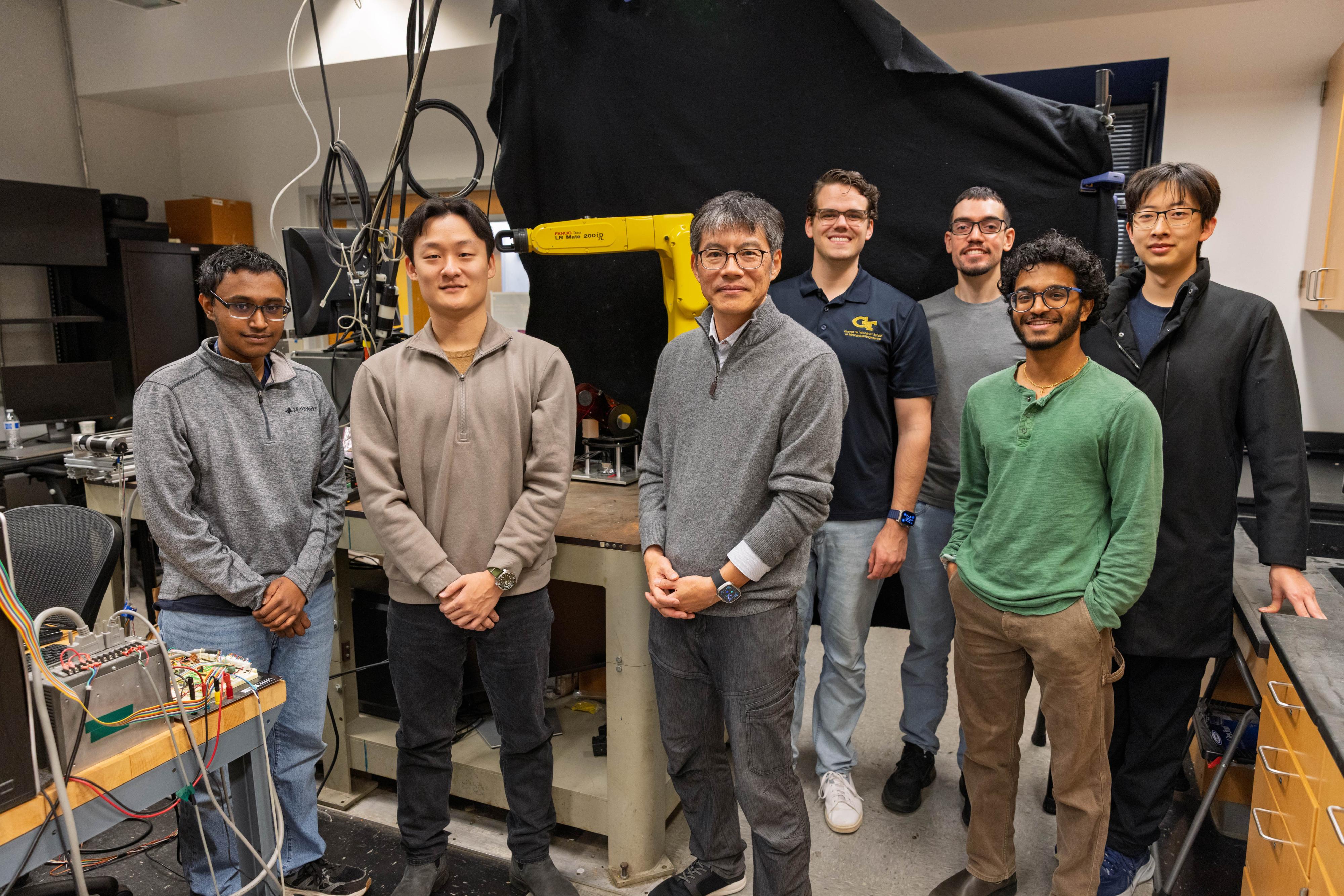 Jun Ueda and students in the lab