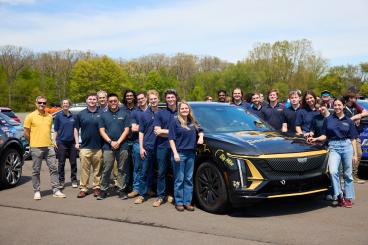 Members of the Georgia Tech EcoCAR EV Challenge team, joined by Doug Williams, interim dean of the College of Engineering, and Ed Argalas, an advanced vehicle development lead engineer at General Motors. Photo courtesy of EcoCAR EV Challenge.