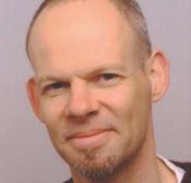 Time resolved measurements of the interaction of polystyrene beads with near-wall coherent structures in a turbulent channel flow