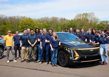 Members of the Georgia Tech EcoCAR EV Challenge team, joined by Doug Williams, interim dean of the College of Engineering, and Ed Argalas, an advanced vehicle development lead engineer at General Motors. Photo courtesy of EcoCAR EV Challenge.