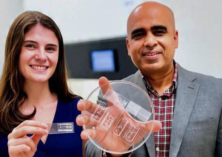 Ankur Singh will lead Georgia Tech’s new ETHOS initiative to advance New Approach Methodologies (NAMs) and transform drug discovery through human-relevant systems. Singh is pictured alongside Ph.D. student Olivia Jones, holding a human immune organ engineered on-a-chip, a breakthrough innovation developed at Georgia Tech to model complex immune responses outside the body.